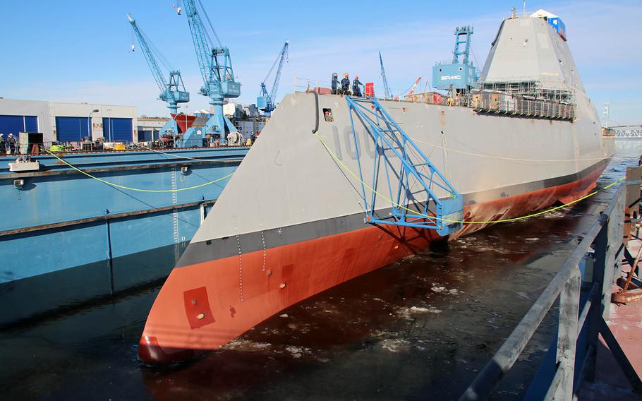 The future USS Lyndon B. Johnson is made ready Saturday before its dry dock at Bath Iron Works, Maine, was flooded and the Zumwalt-class destroyer launched.