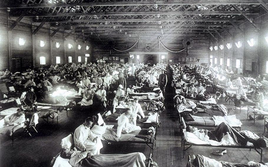 Soldiers suffering from influenza at the hospital in Camp Funston, Kansas in 1918. Camp Funston was where the influenza epidemic which would kill more than 50 million people world-wide, including 675,000 Americans, first made a major appearance. Troops from the camp carried the virus to other Army bases during World War I.