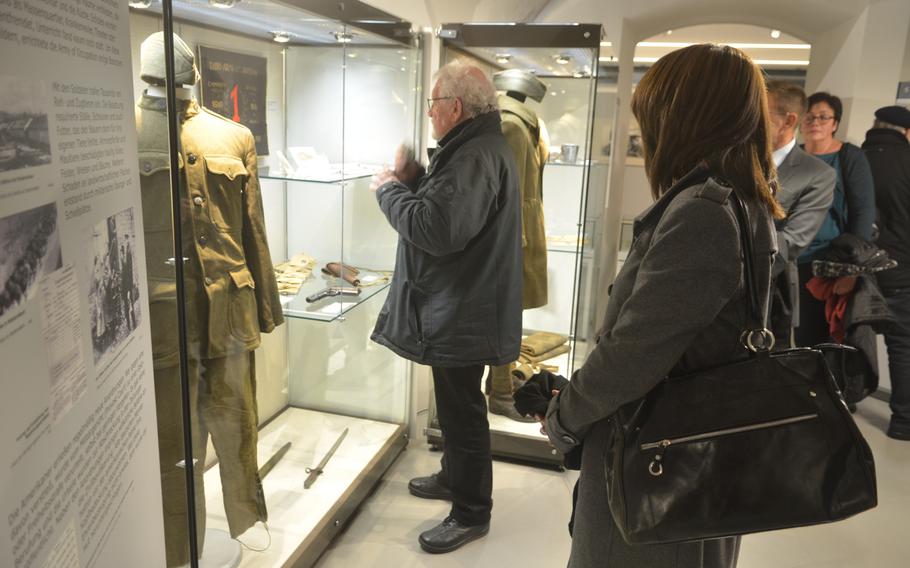 Attendees of the ceremony marking the 100th anniversary of Germany's occupation by U.S. troops are the first to view the exhibit focusing on the historical event, in Hachenburg, Germany, Dec. 13, 2018.