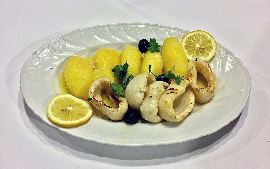 Grilled calamari in butter sauce as served at Lissabon in Kaiserslautern, Germany on Dec. 9. The dish was tasty, not rubbery as calamari often is, and included a few extras -- not all of them desired.