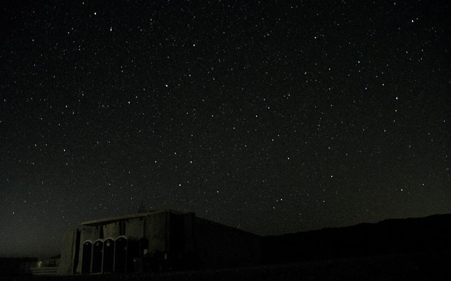 Soldiers at Camp Dahlke West in Afghanistan live on a "blackout" base at night, with all lights turned off to prevent Taliban from sighting their mortars. The base continues to be a favored target for insurgents, with at least 83 rocket or mortar attacks occurring since April.