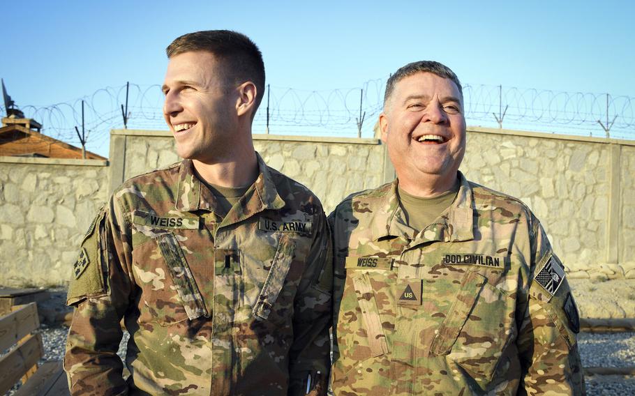 Army 1st Lt. Spencer Weiss, 30, and his father Tom Weiss, 60, a Defense Department civilian, meet Dec. 15, 2018, at Tactical Base Gamberi in Afghanistan. The two both arrived in Afghanistan this year.