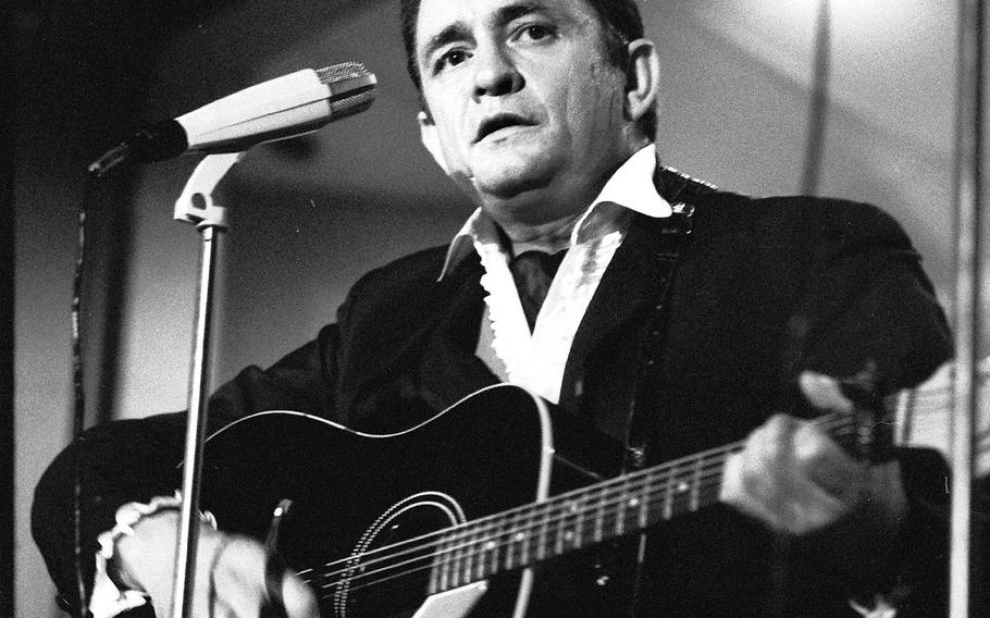 Johnny Cash performs for servicemembers at Rhein-Main Air Base, West Germany, in 1958. It was one of two shows he played at NCO clubs on the base that night. Cash served in the U.S. Air Force and was stationed at Landsberg Air Force Base from 1951 to 1954.
