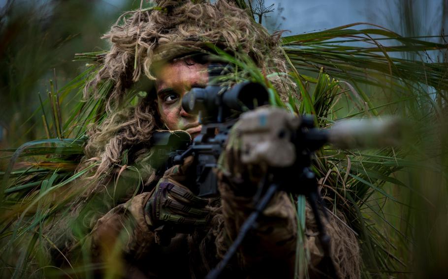 An Army sniper wearing the current Flame Resistant Ghillie System is pictured. The new Improved Ghillie System looks to enhance the snipers' lethality and survivability while being simpler and modular.