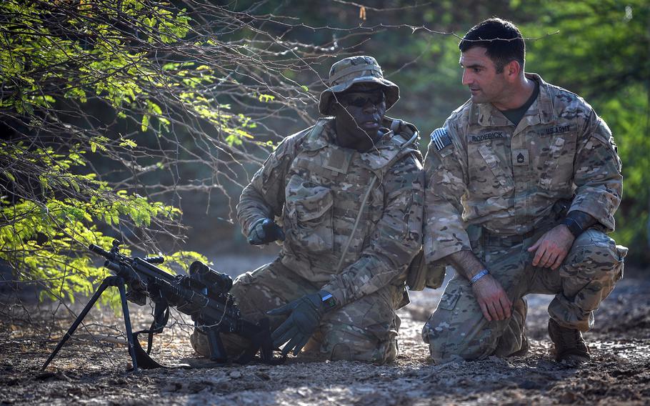 U.S. Army Sgt. 1st Class Paul Roderick, right, mentors Pvt. Joe McCuley, assigned to Viper Company, 1-26 Infantry, 101st Airborne Division (Air Assault), with the East Africa Response Force, during a training exercise at Camp Lemonnier, Djibouti, Dec. 13, 2018.