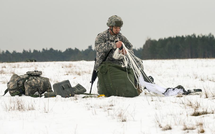 A paratrooper assigned to the 173rd Infantry Brigade Combat Team recovers his parachute in the snow after jumping from a C-130 Hercules into the 7th Army Joint Multinational Training Command's Grafenwoehr Training Area, Germany. Cold-weather injuries in the military were up by almost 20 percent during the last annual period, with Fort Wainwright, Alaska, having the most, followed by Grafenwoehr and Vilseck area in Germany.
