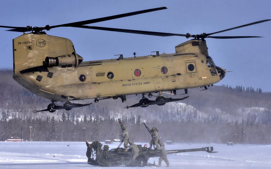 Soldiers assigned to 2nd Battalion, 8th Field Artillery Regiment battle stiff winds, subzero temperatures and blowing snow as they prepare to hook up their 155mm howitzer to a CH-47 Chinook helicopter for the flight to the Yukon Training Area, Alaska, in March. Cold-weather injuries in the military were up by almost 20 percent during the last annual period, with Fort Wainwright, Alaska, having the most, followed by Grafenwoehr and Vilseck area in Germany.