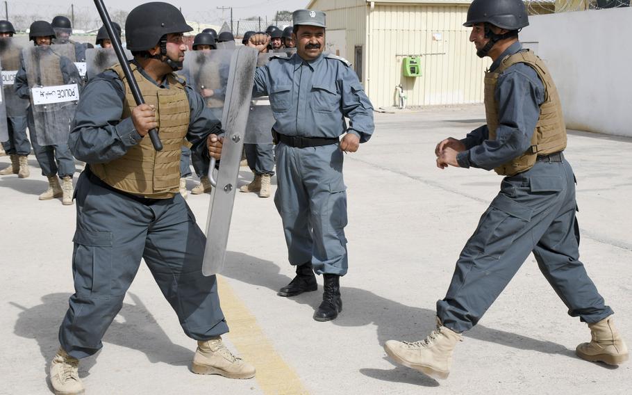Afghan police in training conduct a crowd-control drill with a baton at the Regional Police Training Center in Herat, Oct. 28, 2018. Responsibility for training police primarily belongs to Afghan mentors, with allied troops now focusing on advising at higher echelons and with Afghan special operations. 
