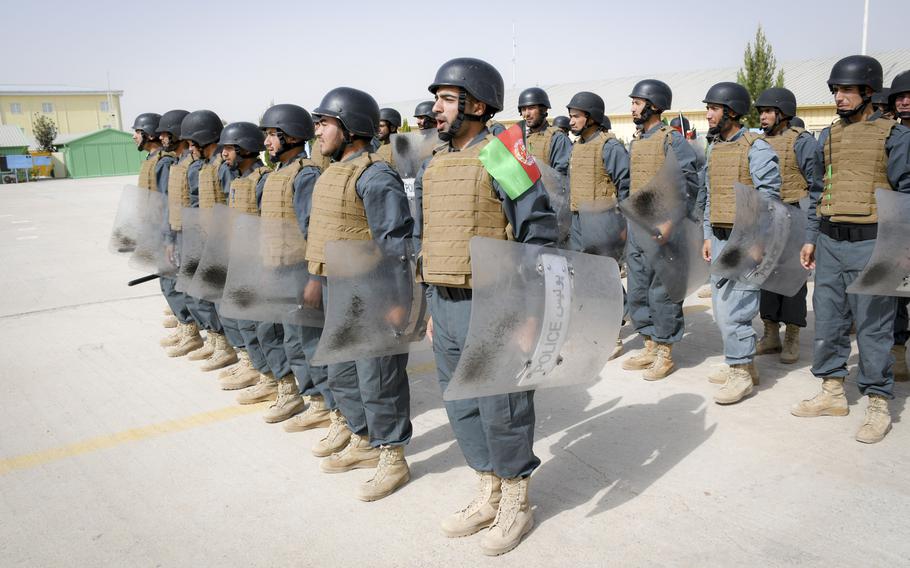 Afghan police in training bellow a warning before banging their batons on their riot shields during a crowd-control drill at the Regional Police Training Center in Herat, Oct. 28, 2018. Responsibility for training police primarily belongs to Afghan mentors, with allied troops now focusing on advising at higher echelons and with Afghan special operations. 
 
