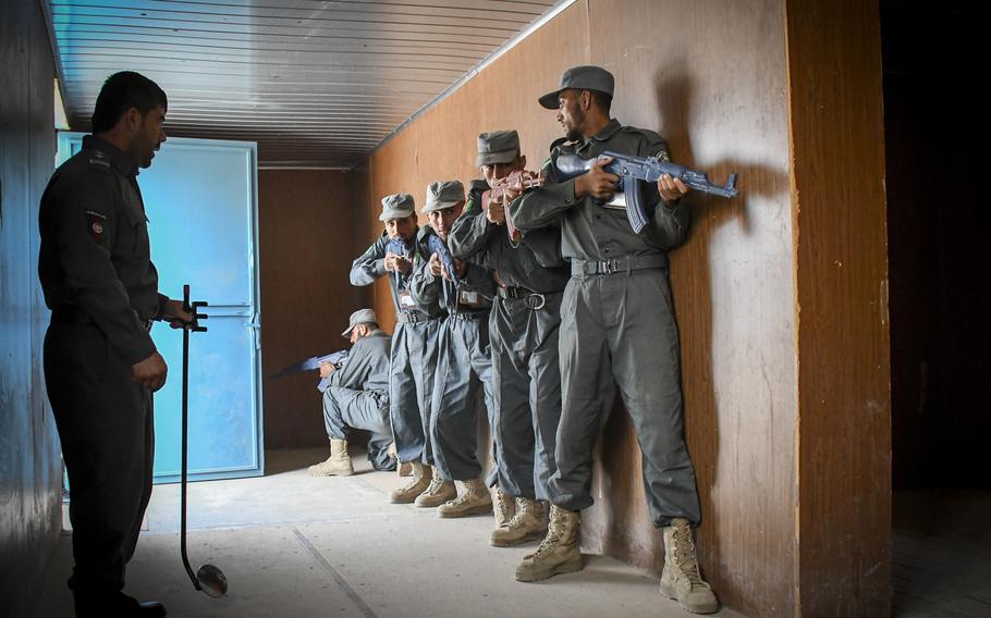 Afghan police in training prepare to clear a building at the Regional Police Training Center in Herat, Oct. 28, 2018. Responsibility for training police primarily belongs to Afghan mentors, with allied troops now focusing on advising at higher echelons and with Afghan special operations. 