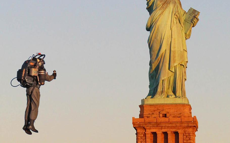 David Mayman, CEO and cofounder of JetPack Aviation, flies the JB-9 jetpack near the Statue of Liberty during a demonstration in November 2015. The company is now working on a prototype for U.S. Special Operations Command.