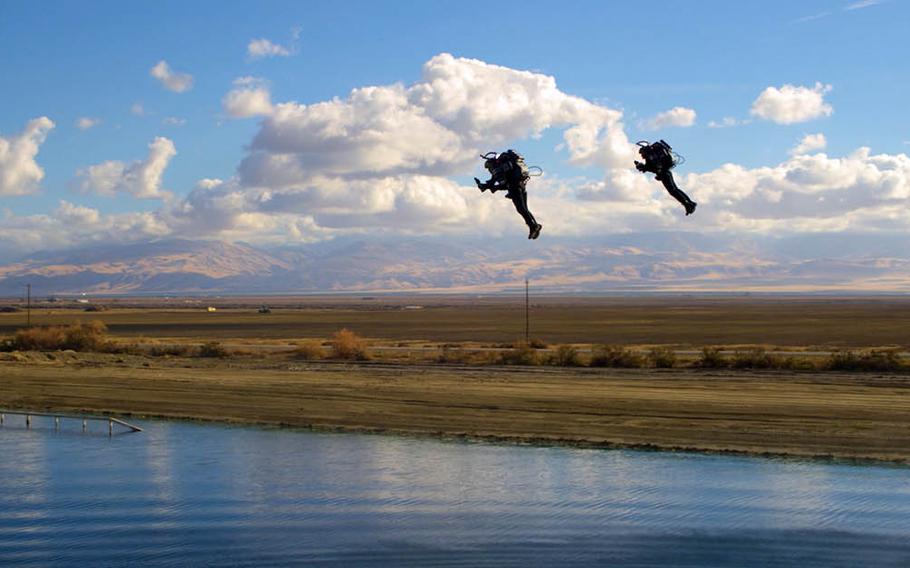 Jetpack Aviation CEO David Mayman and Boris Jarry, the company's operations director, fly over a lake near Taft, Calif., in December 2018.