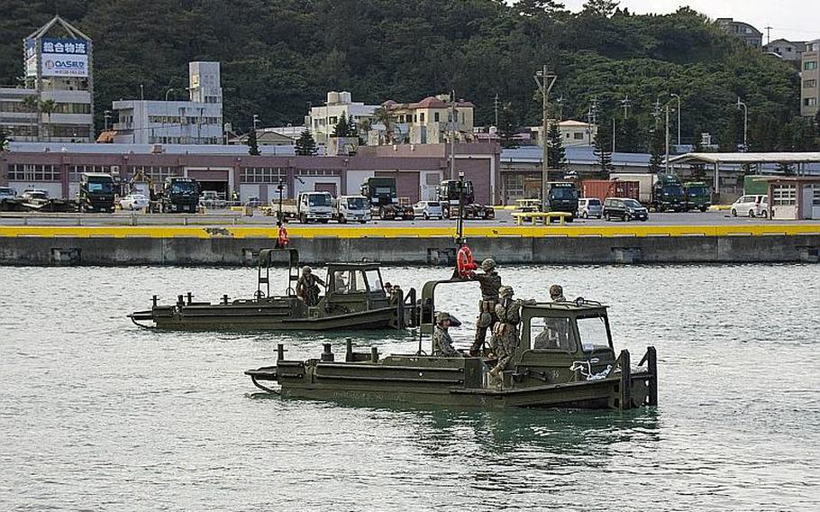 Marines perform maneuvers using a bridge-erection boat at Naha Military Port on Okinawa, Tuesday, Jan. 29, 2019.