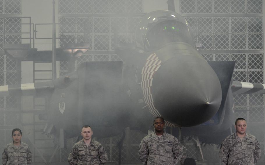 An F-15E Strike Eagle from the 492nd Fighter Squadron painted in a new World War II-inspired design is unveiled to commemorate the D-Day 75th Anniversary, at RAF Lakenheath, England, Thursday, Jan. 31, 2019.