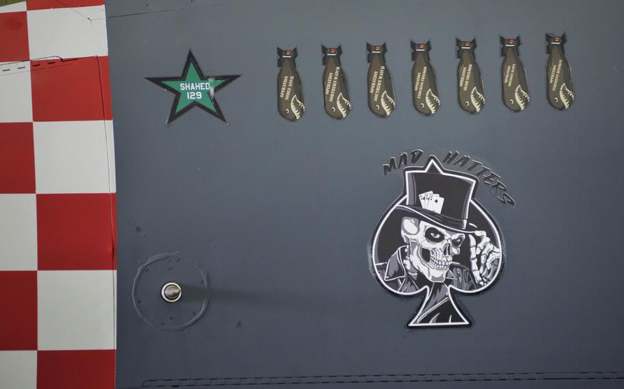 Unit decals below the cockpit of an F-15E Strike Eagle from the 492nd Fighter Squadron painted with a World War II-inspired design to commemorate the D-Day 75th Anniversary, at RAF Lakenheath, England, Thursday, Jan. 31, 2019. The squadron earned its nickname, Mad Hatters, when its pilots swapped their berets for bowler hats after the unit relocated from France to England in 1960.