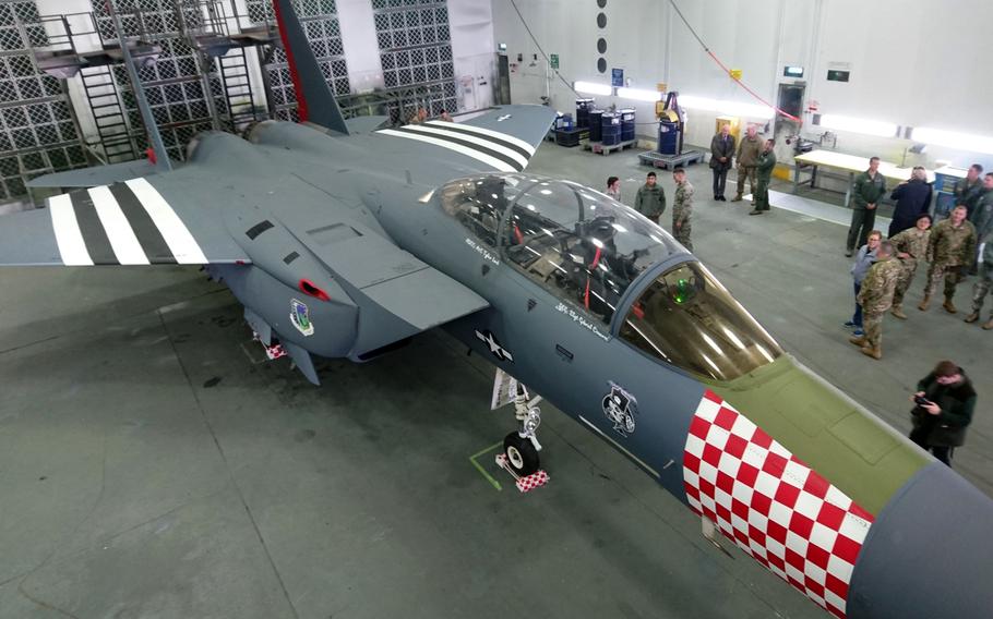 An F-15E Strike Eagle from the 492nd Fighter Squadron painted in a new World War II-inspired design to commemorate the D-Day 75th Anniversary, at RAF Lakenheath, England, Thursday, Jan. 31, 2019. The new paint scheme closely matches the striking red-and-white invasion stripes on P-47 Thunderbolts flown by the 48th FW during World War II.