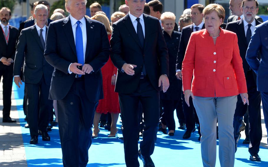 President Donald Trump, NATO Secretary-General Jens Stoltenberg and German Chancellor Angela Merkel walk with other leaders during a NATO meeting in Brussels, May 25, 2017. Germany has missed the Dec. 31 deadline for submitting a spending plans to NATO.