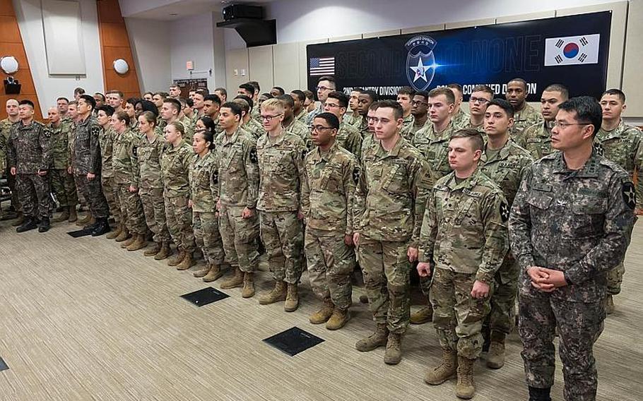 Soldiers assigned to the 2nd Infantry Division stand ready for a live appearance during Super Bowl LIII at Camp Humphreys, South Korea, Monday, Feb. 4, 2019.