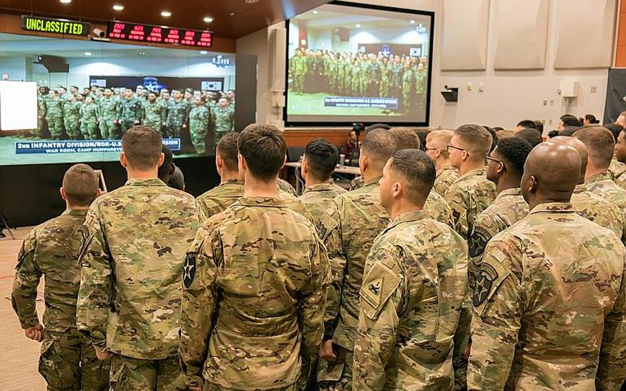 Soldiers assigned to the 2nd Infantry Division appear live during the Super Bowl LIII opening ceremony from Camp Humphreys, South Korea, Monday, Feb. 4, 2019.