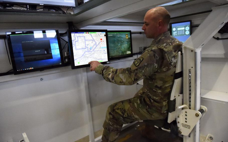 Maj. Rick Grant, the assistant product manager for tactical gaming, tests out one of the Stryker Virtual Collective Trainers at Vilseck, Germany, Thursday, Feb. 7, 2019.
