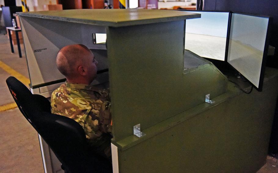 Maj. Rick Grant, the assistant product manager for tactical gaming, tests out one of the Stryker Virtual Collective Trainers at Vilseck, Germany, Thursday, Feb. 7, 2019.