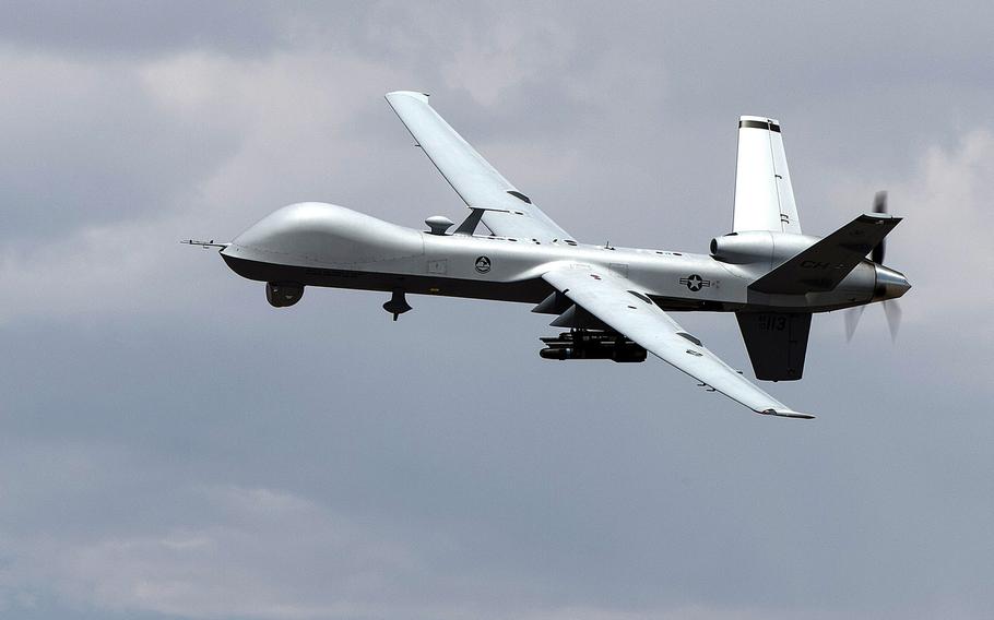 An MQ- Reaper remotely piloted aircraft performs aerial maneuvers over Creech Air Force Base, Nev., in 2015.