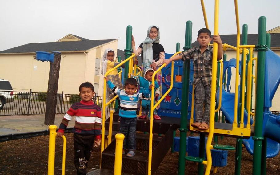 Six of Waheed Etimad's children are pictured here on a playground in Houston in a photo posted to Facebook on Jan. 29, 2015, shortly after the family immigrated from Afghanistan. 