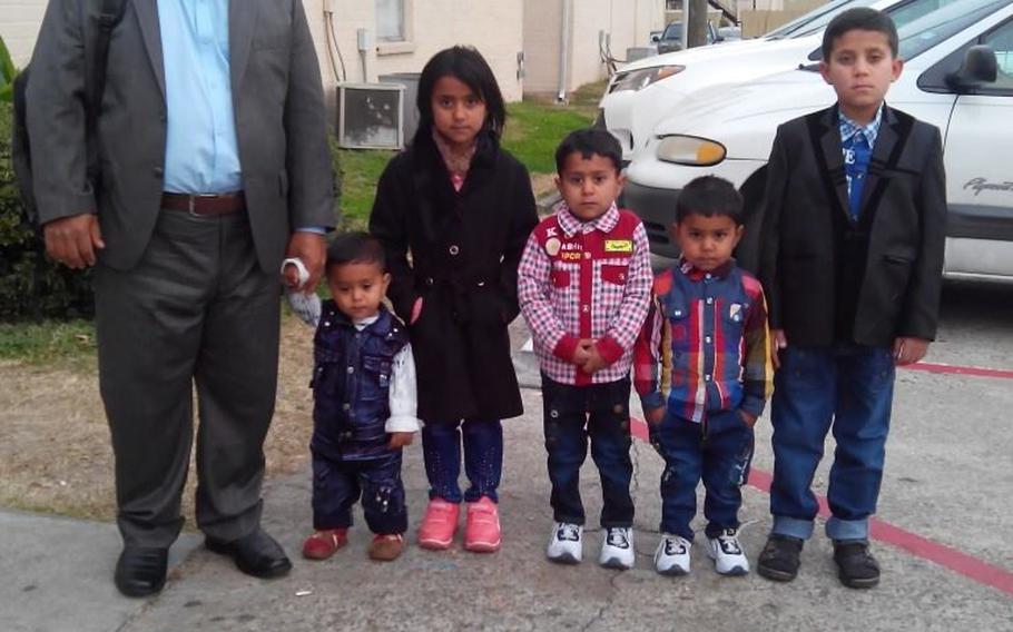 Waheed Etimad and five of his children are pictured here in Houston before going to get Social Security cards, according to a Facebook post on Jan. 31, 2015, shortly after the family immigrated from Afghanistan. 