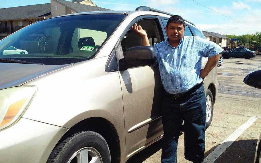 Waheed Etimad is pictured here with a minivan in a photo posted to his Facebook page on March 18, 2015, a few months after the former contract translator and his family immigrated to the United States from Afghanistan, where his work helped the Army and the Drug Enforcement Administration, former colleagues said. 