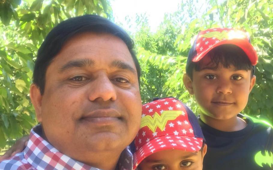 Waheed Etimad is pictured here with two of his seven children in a photo posted to his Facebook page on June 26, 2018.