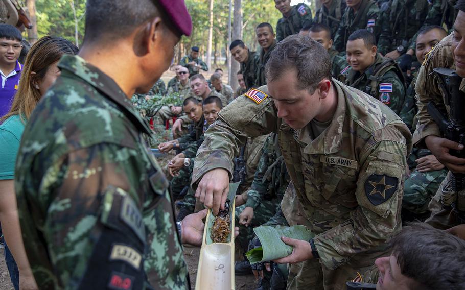 U.S. Army Pfc. Kyle Ridge, a combat medic with Bravo Company, 5th Battalion, 20th Infantry Regiment, samples insects during exercise Cobra Gold 19 at Phitsanulok, Thailand, on Feb 13., 2019.