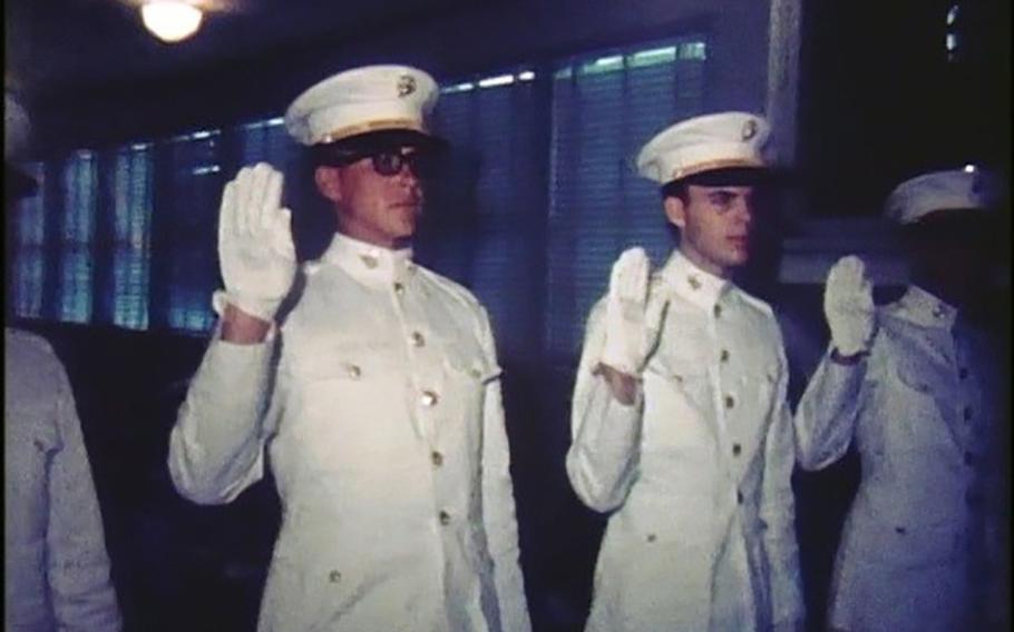 A screenshot from a home video taken June 7, 1967, the day David Nelson, right, and Lee Roy Herron commissioned as officers in the Marine Corps. 