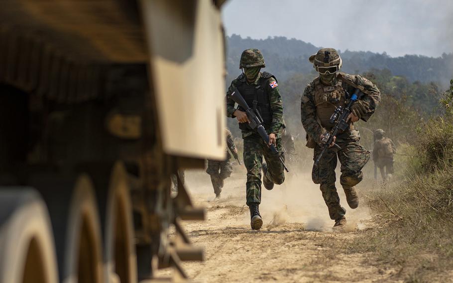 U.S. and Royal Thai Marines run to an amphibious-assault vehicle during a Cobra Gold drill in Ban Chan Krem, Thailand, Feb. 20, 2019.