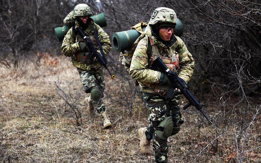 Georgian soldiers run toward their next defensive position during training at the Georgia Defense Readiness Program, in Tbilisi, Georgia, Wednesday, Feb. 20, 2019. 