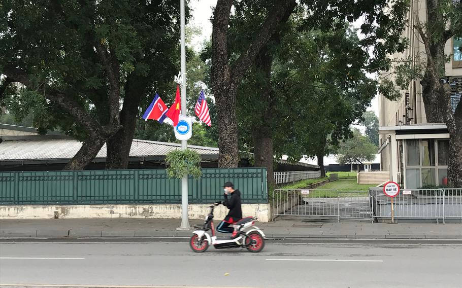 Flags of North Korea (left), Vietnam (center) and the United States (right) are hung throughout Hanoi as the capital prepares for the summit between President Donald Trump and Kim Jong Un.