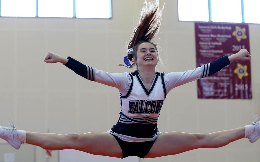 Seoul American's Rowan Beaudry smiles as she leaps during the Far East cheerleading competition at Marine Corps Air Station Iwakuni, Japan, Feb. 23, 2019.