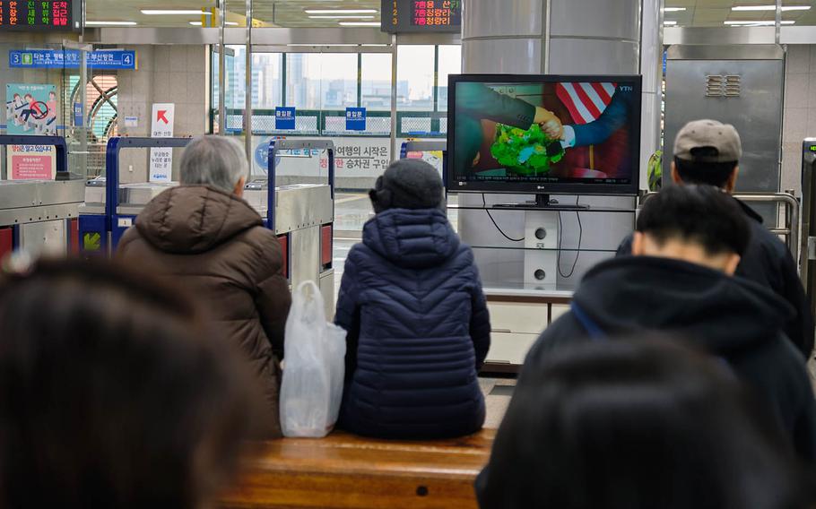 South Koreans watch news coverage of the Trump-Kim summit at a subway station in Seojeong, South Korea, Wednesday, Feb. 27, 2019.