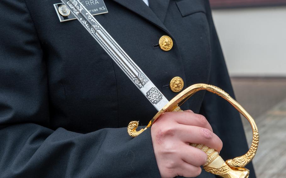 Nubia Guerra, Naples, hold her saber at the DODEA-Europe JROTC drill team championships at Ramstein, Germany, Saturday, March 2, 2019.