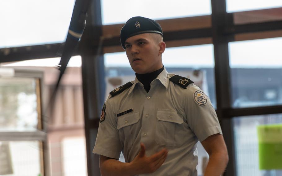 Ramstein's Jackson Hill tosses his rifle as he competes in the rifle solo exhibition during the DODEA-Europe JROTC drill team championships at Ramstein, Germany, Saturday, March 2, 2019.