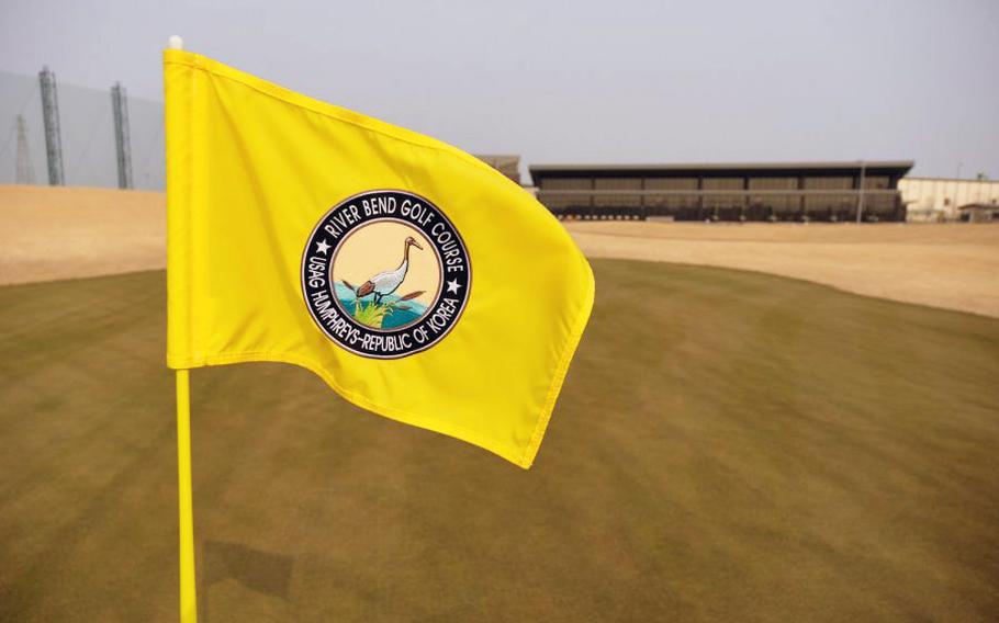 The pin flag at the 18th hole of the new River Bend Golf Course waves at Camp Humphreys, South Korea, March 27, 2019.