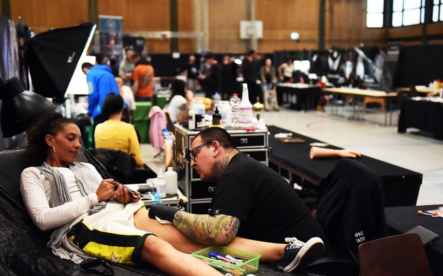 U.S. soldiers and family members joining German citizens in getting tattooed at the Grafenwoehr Tattoo Expo, in Grafenwoehr, Germany, Sunday, April 8, 2019.