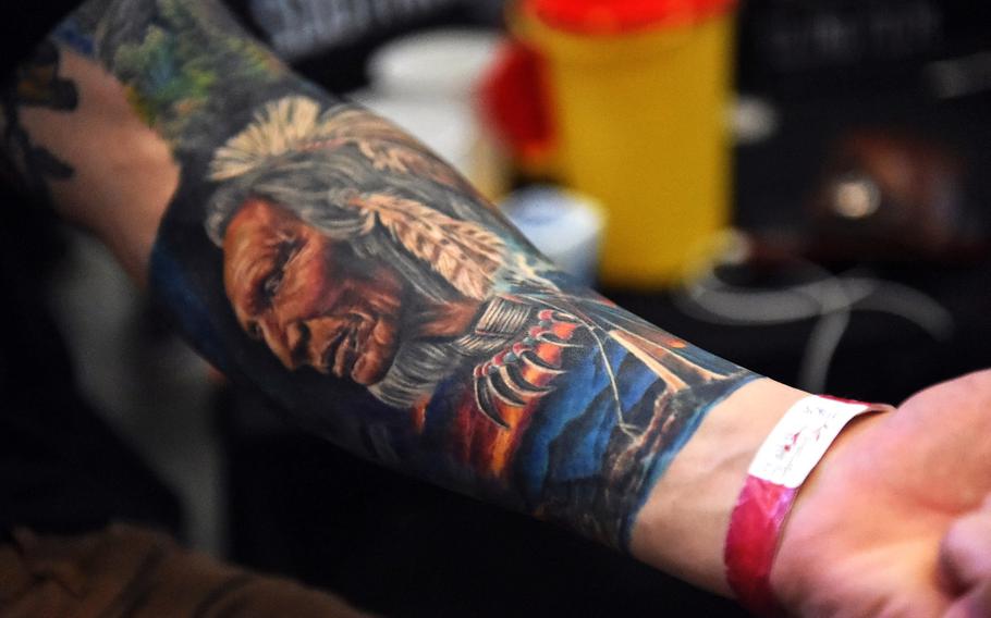 A soldier's Native American-themed tattoo at the Grafenwoehr Tattoo Expo, in Grafenwoehr, Germany, Sunday, April 8, 2019.