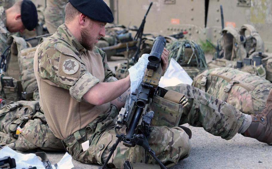 A Danish servicemember cleans his weapon prior to moving into the field for Allied Spirit X at Joint Multinational Readiness Center in Hohenfels, Germany, April 4, 2019.   The exercise includes approximately 5,600 participants from 15 nations at the 7th Army Training Command?s Hohenfels Training Area in southeastern Germany.