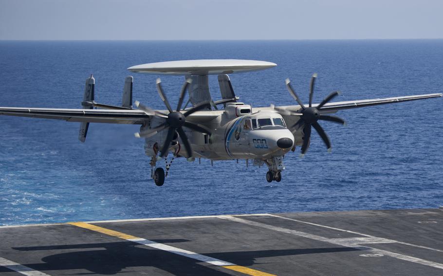 An E-2D Hawkeye from Carrier Airborne Early Warning Squadron 126 prepares to land on the flight deck of the USS Harry S. Truman, June 2018. The Navy awarded Northrop Grumman a $3.2-billion five-year contract modification to buy 24 E-2D Advanced Hawkeye airborne surveillance aircraft.