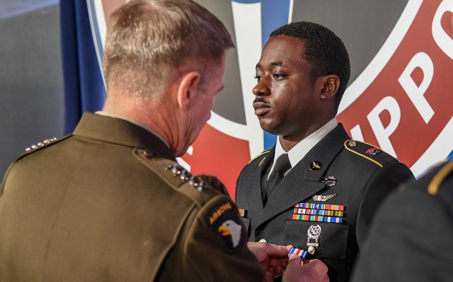 Gen. James McConville, Army vice chief of staff, presents the Silver Star to Sgt. Emmanuel Bynum during a ceremony at the Army Aviation Association of America Summit 2019 in Nashville, Tenn. on Tuesday, April 16, 2019.