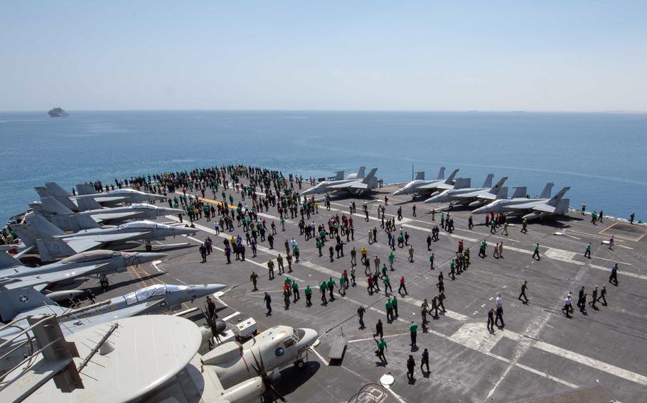 Sailors conduct a foreign object debris walk on the flight deck of the aircraft carrier USS John C. Stennis in the Suez Canal, April 20, 2019. The ship was headed for the Mediterranean Sea where it will join the USS Abraham Lincoln in the 6th Fleet area of operations.