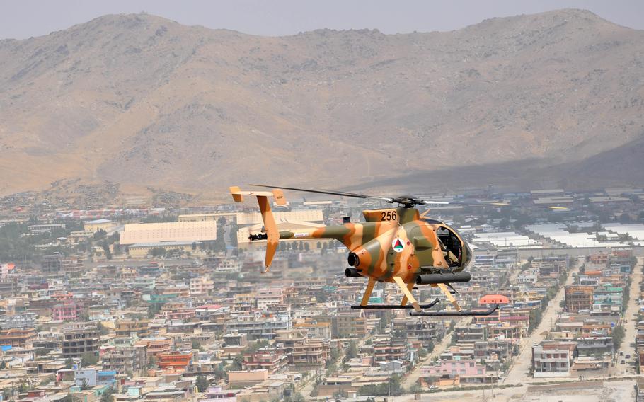 An Afghan MD-530 Cayuse Warrior attack helicopter flies over Kabul on Aug. 25, 2016. The United Nations has expressed concern over the number of civilians killed by Afghan and American airstrikes so far this year.
