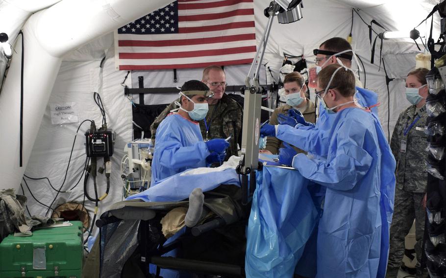 Airmen from the 86th Medical Group, Ramstein Air Base, Germany, participate in a multinational medical exercise drill during Vigorous Warrior 19, Cincu Military Base, Romania, April 8, 2019.