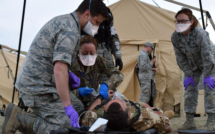 Airmen from the 86th Medical Group, Ramstein Air Base, Germany, participate in a multinational medical exercise drill during Vigorous Warrior 19, Cincu Military Base, Romania, April 8, 2019. With more than 2,500 participants from 39 countries, Vigorous Warrior 19 is NATO?s largest-ever military medical exercise.