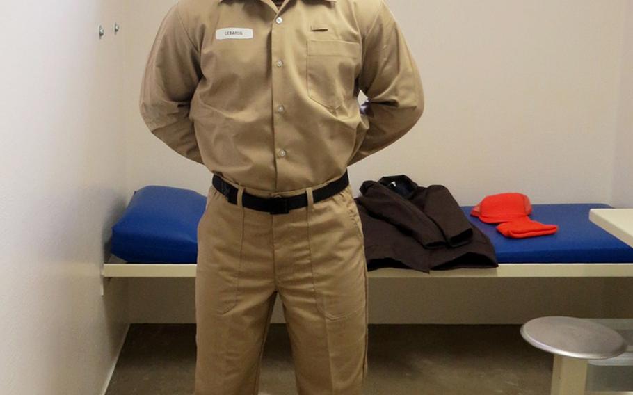 A sailor models the Navy's new post-trial standardized prisoner uniform, which will be mandatory for all prisoners beginning Wednesday, May 1, 2019.